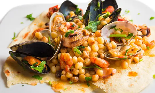 fregula ai frutti di mare dish from top