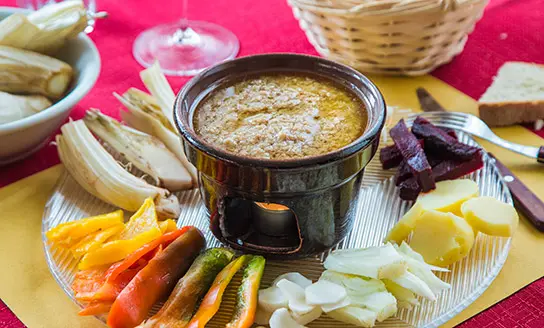 crudites platter served with bagna cauda dish from top