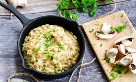 mushrooms risotto with parsley from top