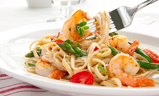 linguine with spicy shrimp and cherry tomatoes dish from top