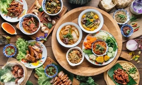 table full of thai cuisine dishes from top